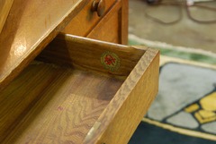 Top center drawer extended, Stickley Associated Cabinetmakers co-joined decal signature, 1916-1919.